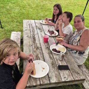 Gisele Retirement – Gisele with grandkids and daughter